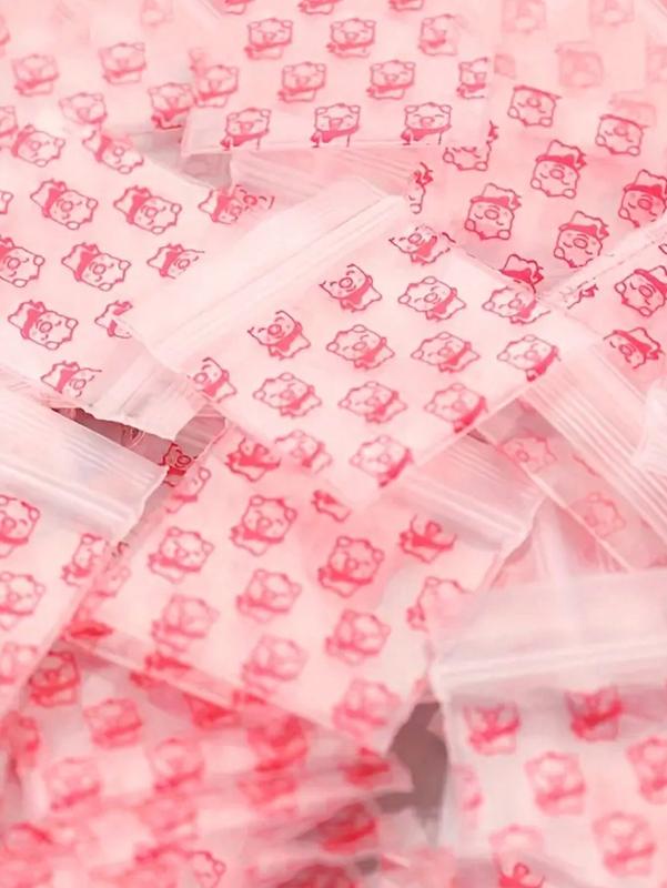 100PCS Pink Piggy Print Ziplock Bag Small Plastic Zipper Bag Portable Packaging for Storing Snacks Cards Jewelry Bag and Other Small Items